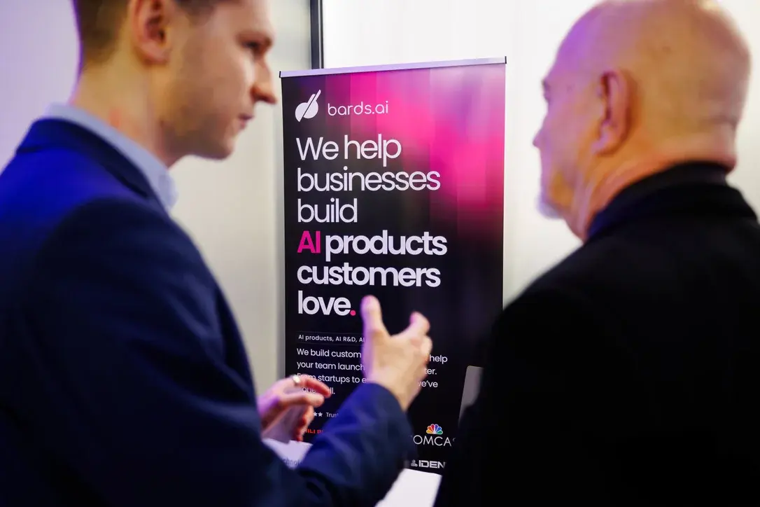 bards.ai team in conversation at an industry event